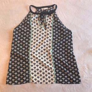 Sleeveless, flowy keyhole neckline top.